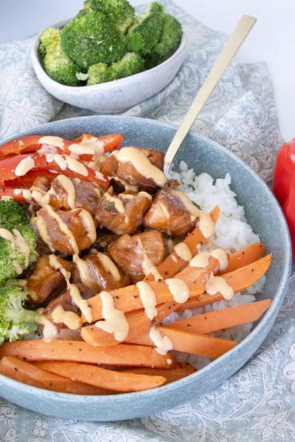 Rice bowl with glazed chicken, carrots, and broccoli